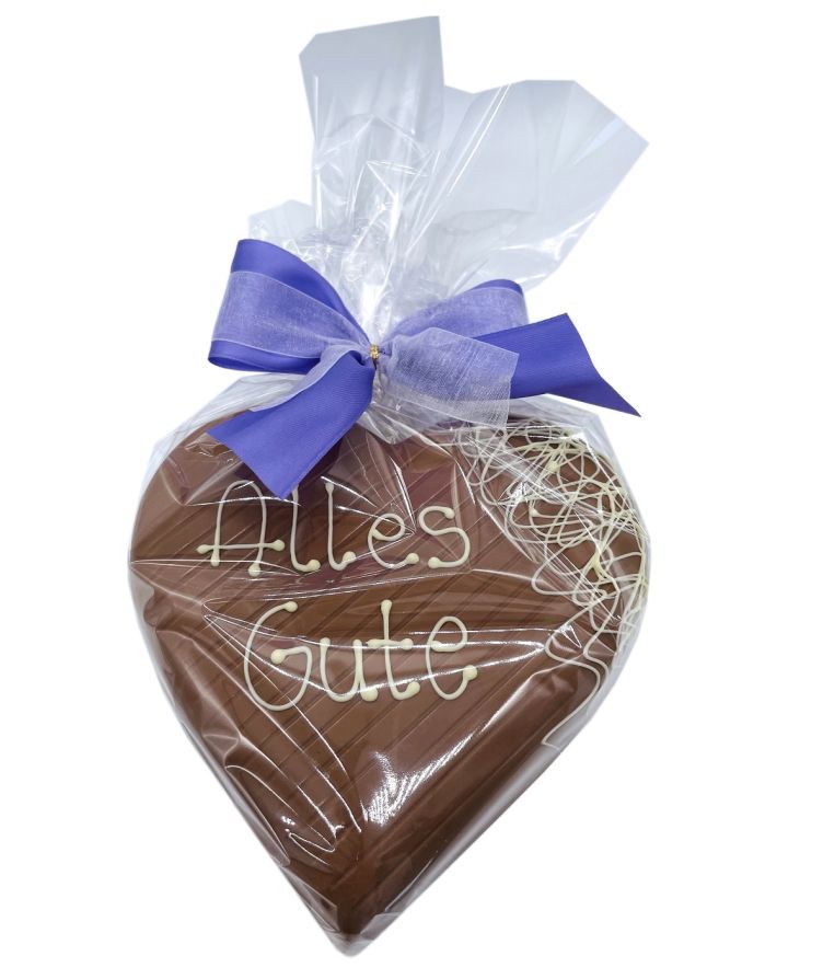 Verpacktes Klett Schokoladen Herz mit der Botschaft "Alles gute"